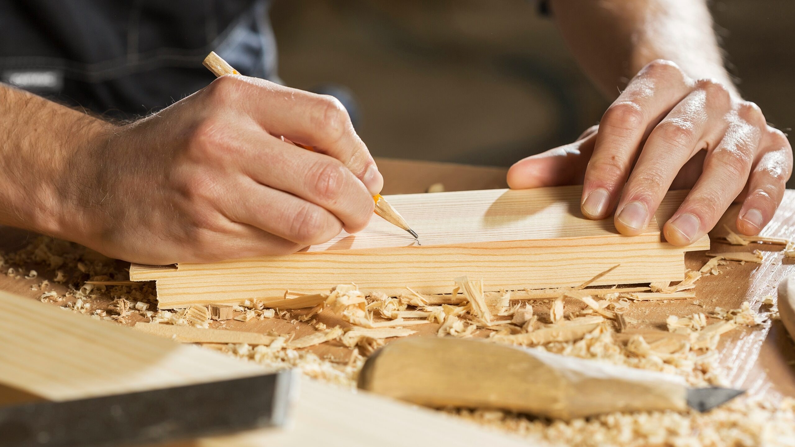 Carpenter assembling wooden furniture